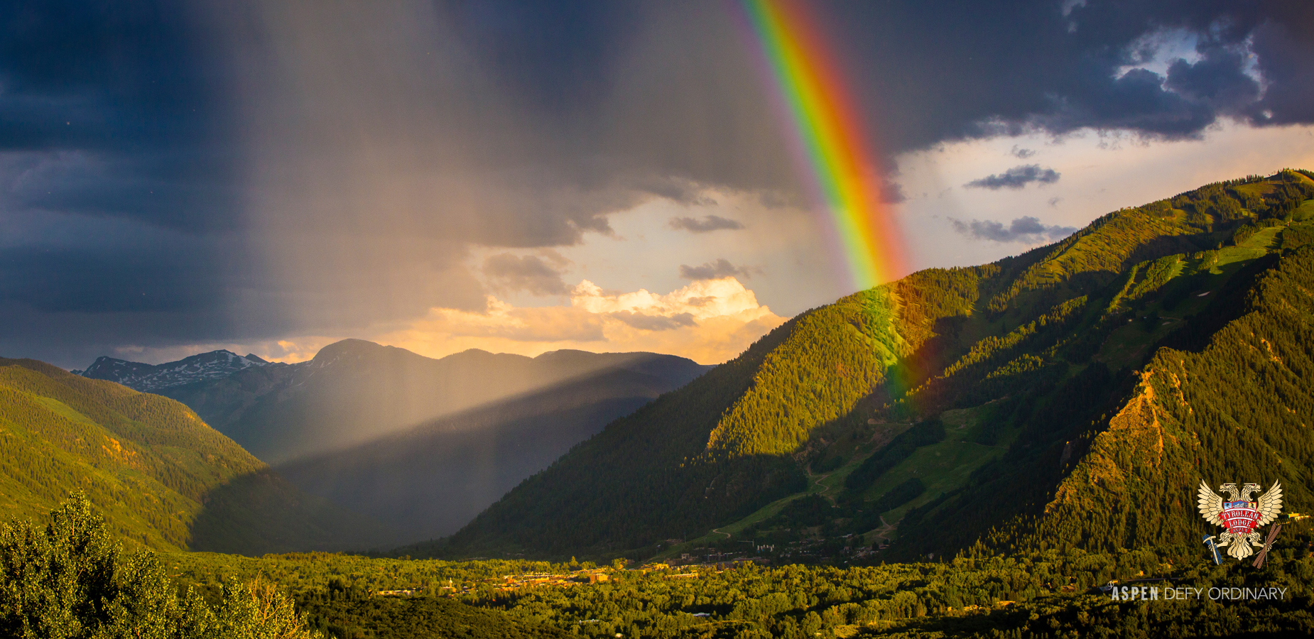 Rain showers and rainbow hits Ajax Mountain