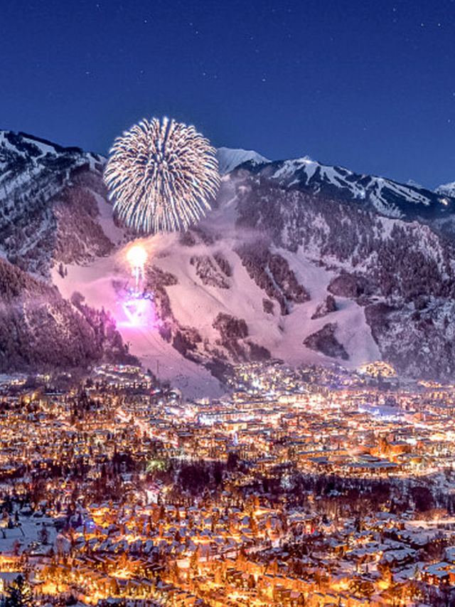 Winter fireworks over nighttime Aspen town